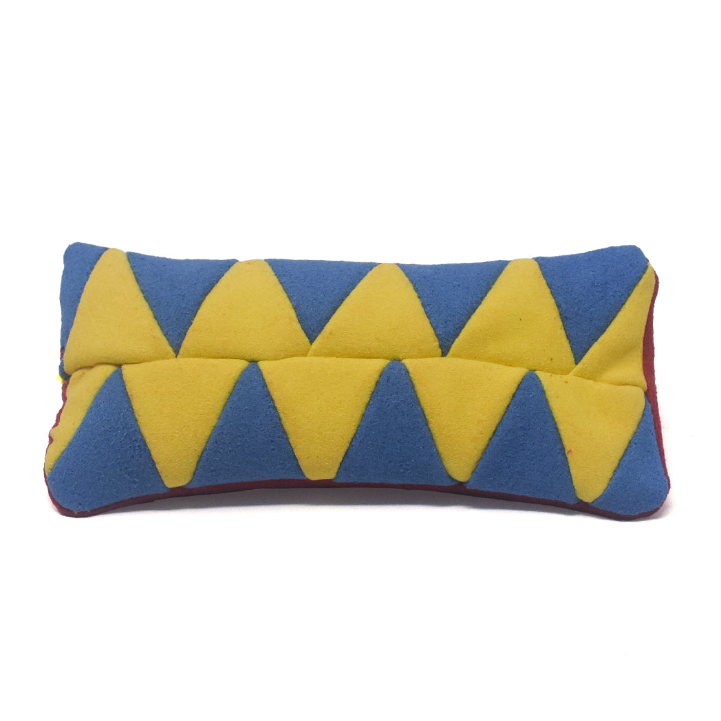 Rectangular pillow with blue and yellow zigzag pattern on a white background